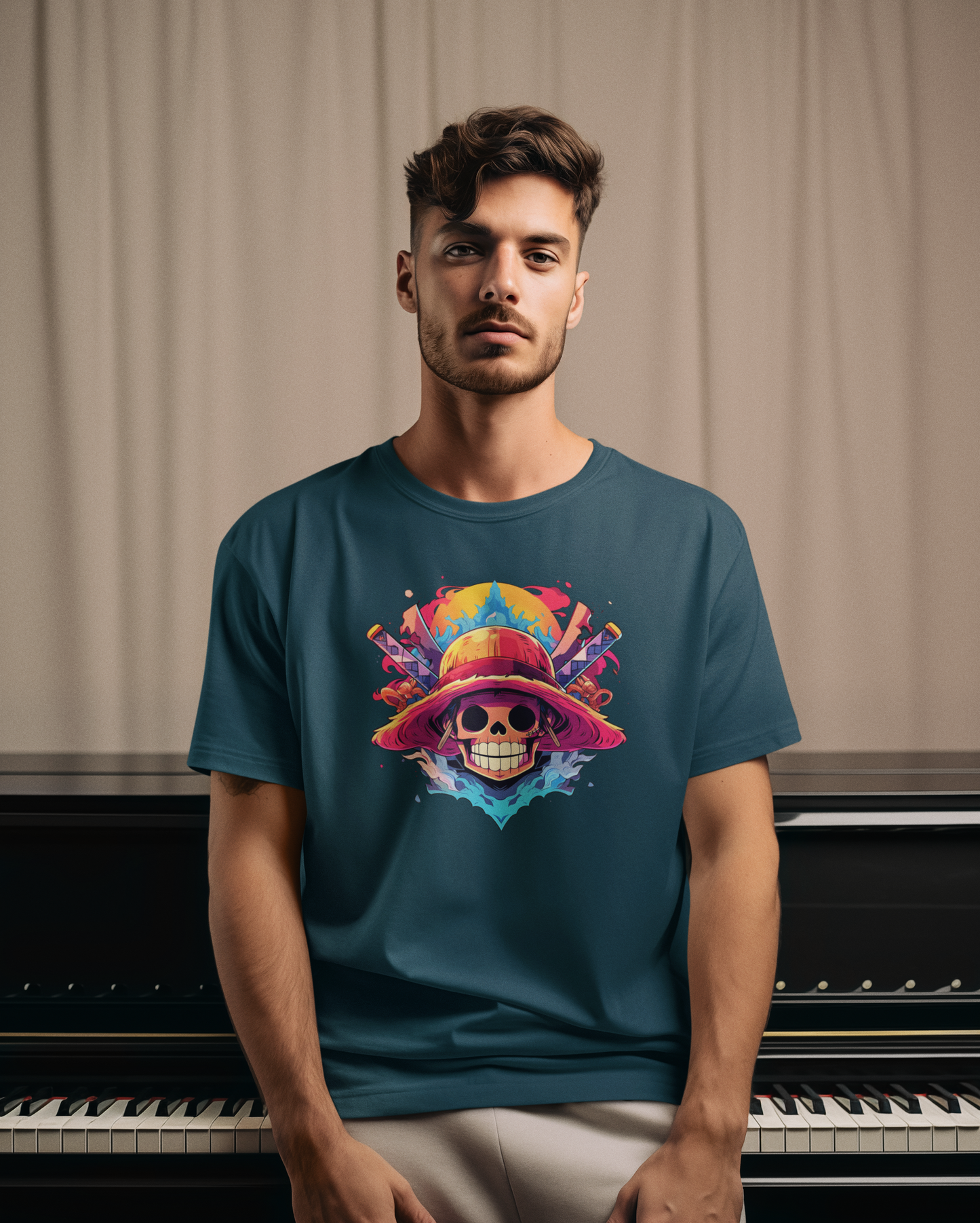 Man wearing a teal t-shirt with a colorful skull design in front of a piano.