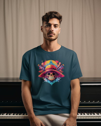 Man wearing a teal t-shirt with a colorful skull design in front of a piano.